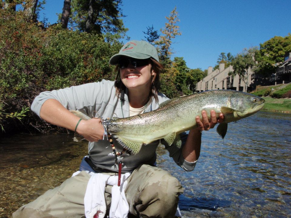 Allison Voglesong and salmon on the Crystal River in MI.