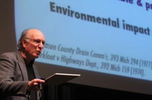 Jim Olson, chairman of For Love of Water, explains the possible legal approaches that might be taken to regulate hydraulic fracturing, or 'fracking,' Thursday evening at the Alverson Center for Performing Arts at Fowlerville High School. / ALAN WARD/DAILY PRESS & ARGUS